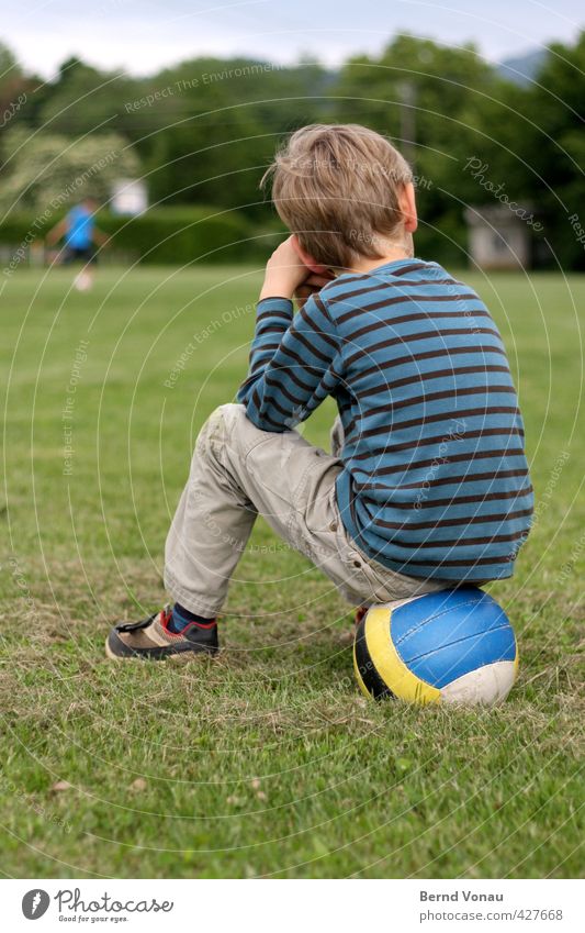 half Ball sports Sporting Complex Football pitch Masculine Child Boy (child) Infancy 1 Human being 3 - 8 years Sit Blue Multicoloured Yellow Gray Green White