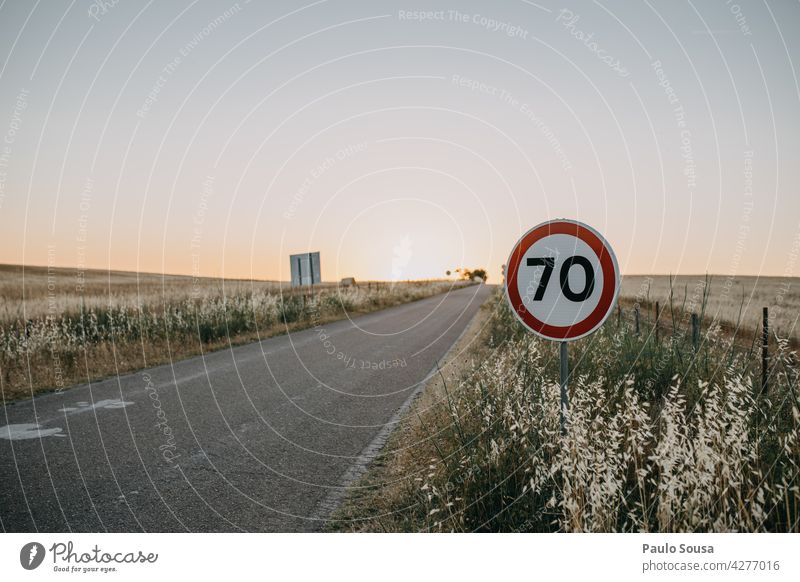 Speed limit sign 70 Traffic infrastructure Driving Exterior shot Road sign Road traffic Transport Motoring Street Colour photo Signs and labeling Day Signage