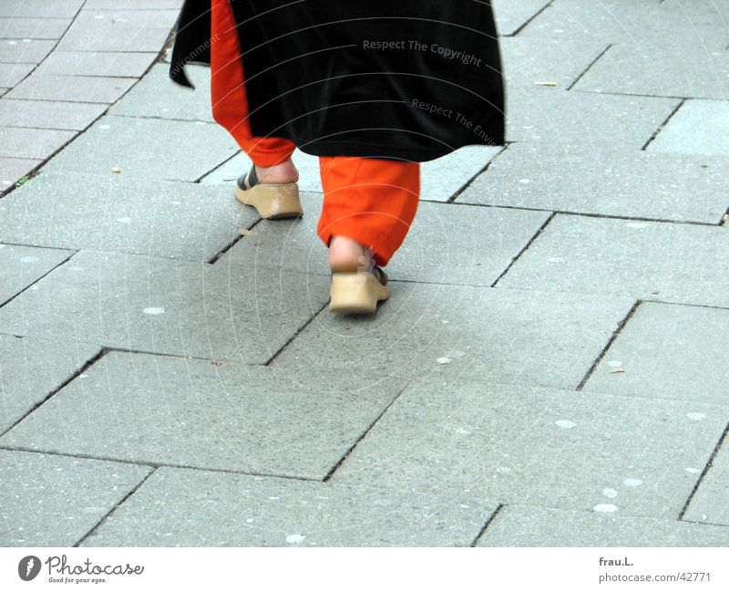 orange pants Woman Sidewalk Going Footwear Moslem Motion blur Human being Clothing pumphose Orange Feet