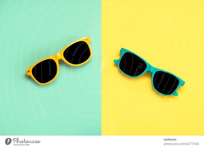 Top view of green and yellow sunglasses summer beach holidays creative pattern uv accessory protect eye wearing eyewear accessories protection nobody cool