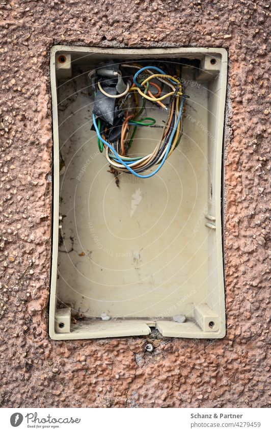 Installation box with loose cables in plastered house wall electrical installation Cable broken Redecorate repair Entrance Terminal connector Broken Bell