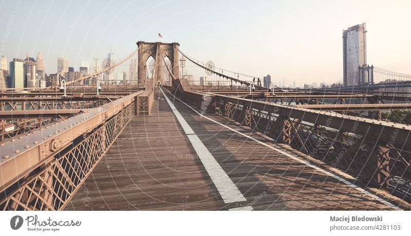 Panoramic view of Brooklyn Bridge, color toned picture, New York City, USA. city skyline Manhattan Big Apple cityscape retro vintage effect building filtered