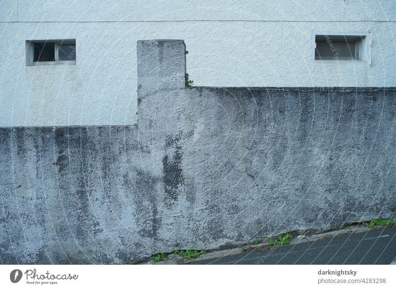 Face-like facade with windows similar to eyes and a wall in the basement Facade Wall (barrier) Architecture Window Cellar Deserted Exterior shot Colour photo