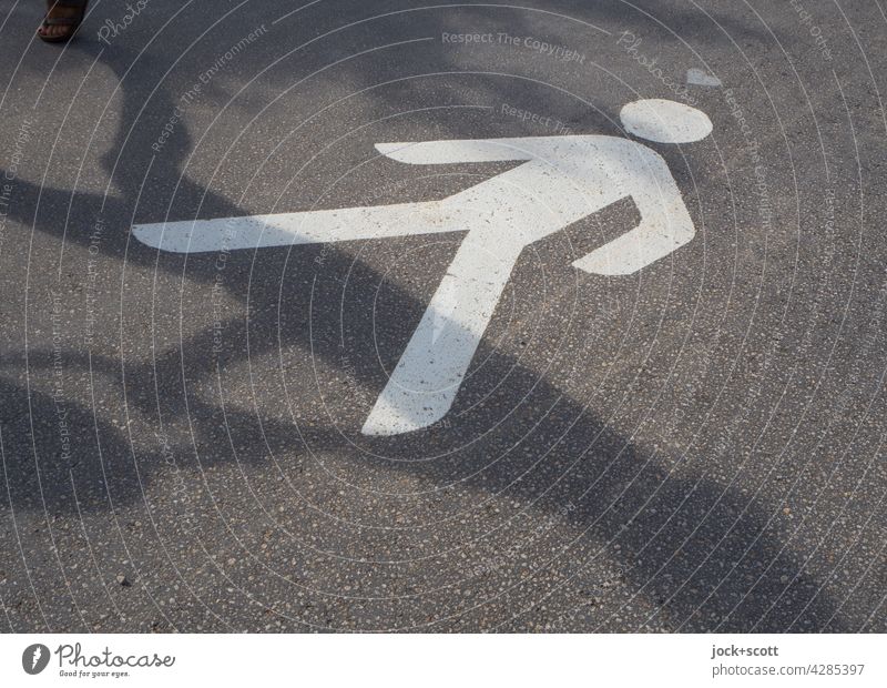 Pedestrians cast their shadows ahead Pictogram Lanes & trails Signs and labeling Going Shadow play Neutral Background Silhouette Asphalt Heart (symbol) Sunlight
