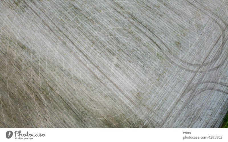 Tractor tracks on a freshly plowed field Area flight aerial view agricultural agricultural area bird's eye view copy space drone flight from above landscape