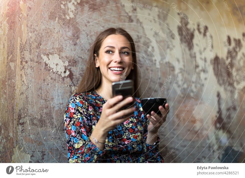 Woman with mobile phone at cafe people woman young adult casual attractive female smiling happy Caucasian toothy enjoying one person beautiful portrait