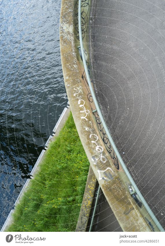 curved pedestrian bridge made of prestressed concrete Bridge Architecture Water Grass Structures and shapes Symmetry Neutral Background Concrete Bird's-eye view
