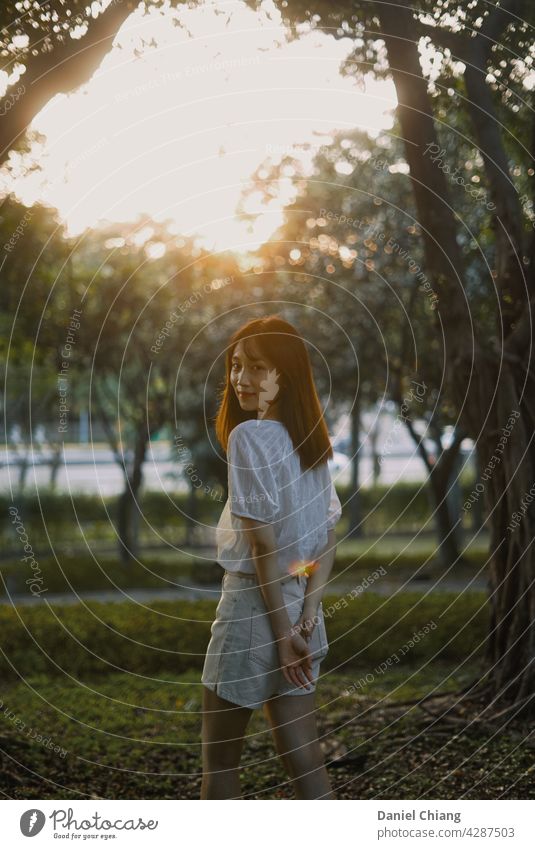 Young Asian Girl In The Park With Sunset girl portrait sunset sunrise afternoon cute lovely teen skinny sunset mood lifestyle smile happy young summer travel