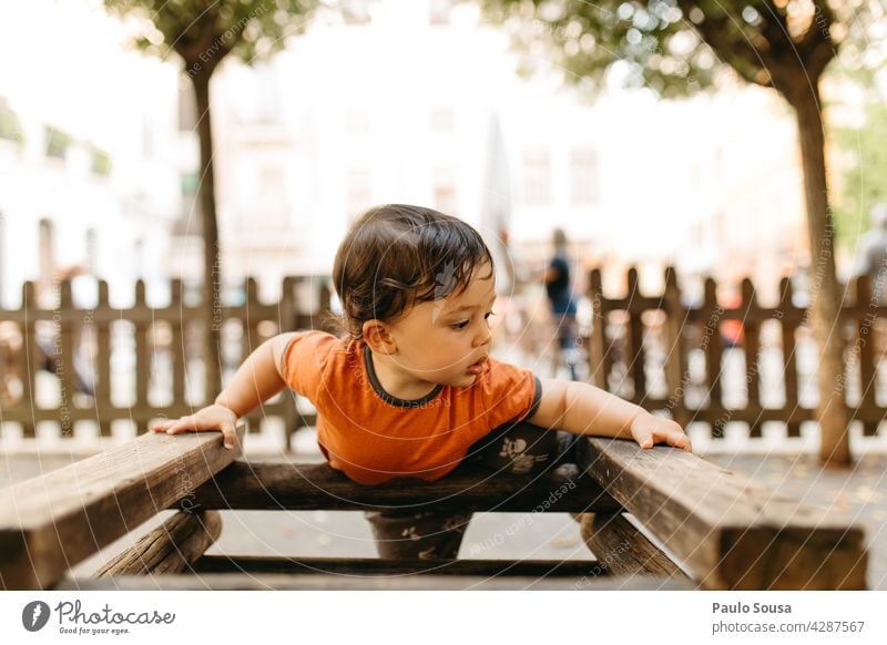 Child playing in the playground Boy (child) Caucasian 1 - 3 years Playing Playground Kindergarten Summer Infancy Toddler Colour photo Exterior shot Joy