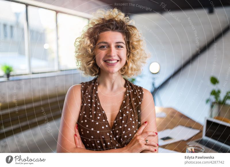 Portrait of confident creative woman in her office business businesspeople businessperson businesswoman caucasian female indoors informal casual young adult