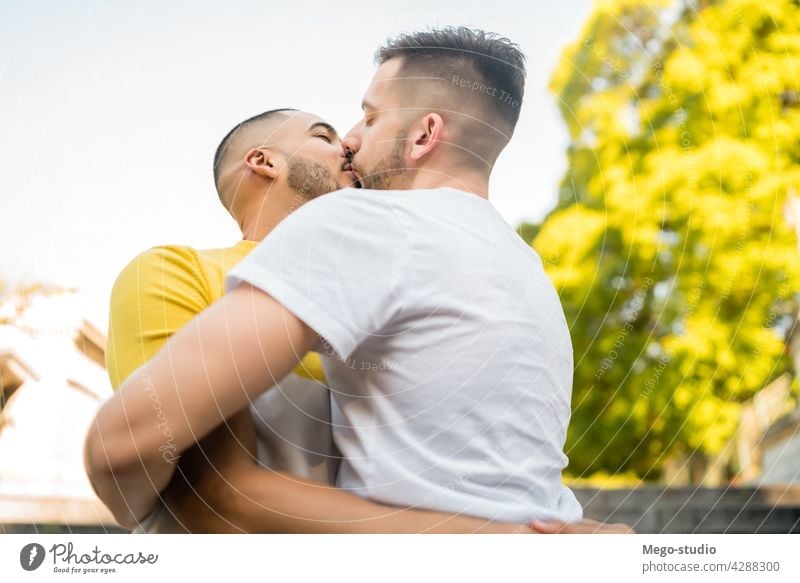 Gay couple spending time together at the park. gay love relationship resting date lovely partnership positive relax freedom life young pride nature dating