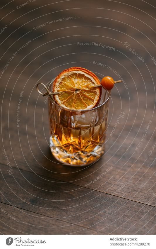 Glass of whiskey with lemon and ice cognac drink alcohol cold composition bar brandy liquor bourbon malt booze beverage citrus cool arrangement aperitif bitter