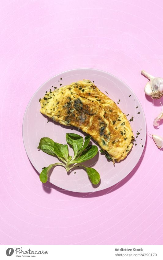 Delicious omelet with fresh spinach leaves and chopped parsley breakfast food nutrition natural ingredient delicious cutlery vegetable clove garlic herb leaf