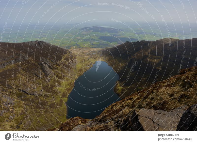 horizontal image of an Irish mountain lake. Comeragh Mountains, Waterford, Ireland adventure mountain peak location lake mountains trekking travel destination