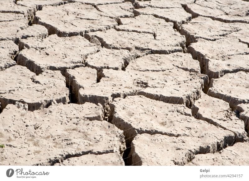Riverbed in drought abstract arid background black blue brown concept crack dead deep desert design diggings dry dryness dust earth empty environment evaporate