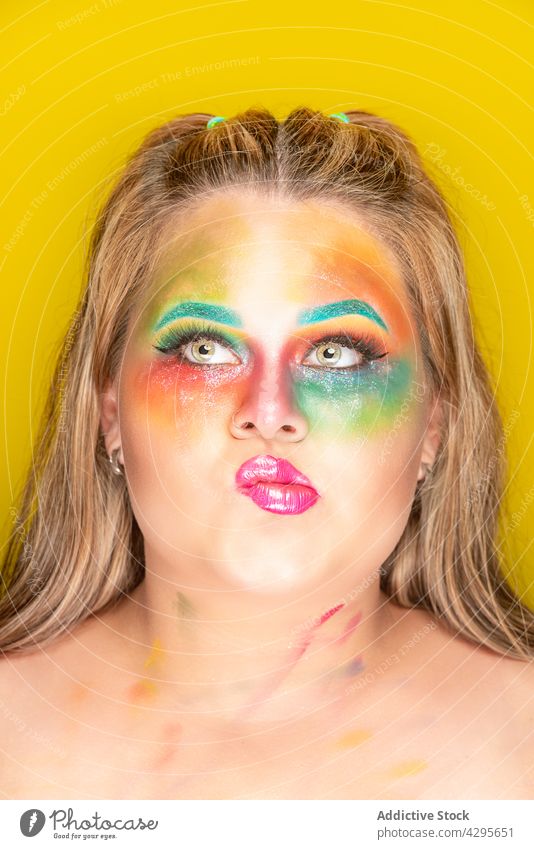 Plump woman with creative makeup colorful model bright appearance portrait human face plump plus size vivid vibrant overweight fashion chubby multicolored