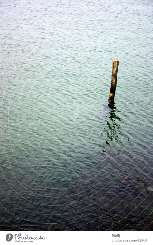 lonely at sea Ocean Green Waves Reflection Blue Pole Water Joist Harbour