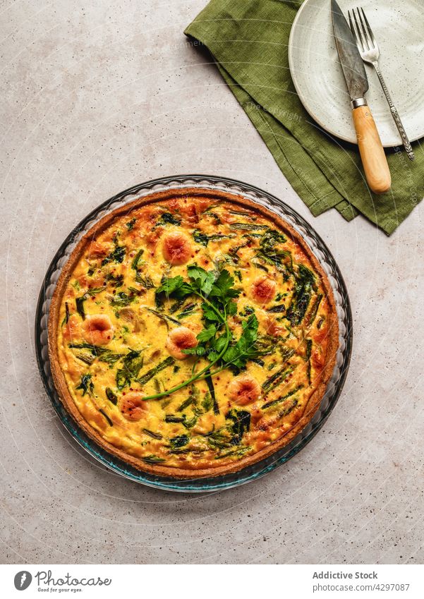 Delicious quiche placed near ingredients tart dish food fresh nutrition cuisine vegetable french tradition parsley authentic organic herb culinary gastronomy