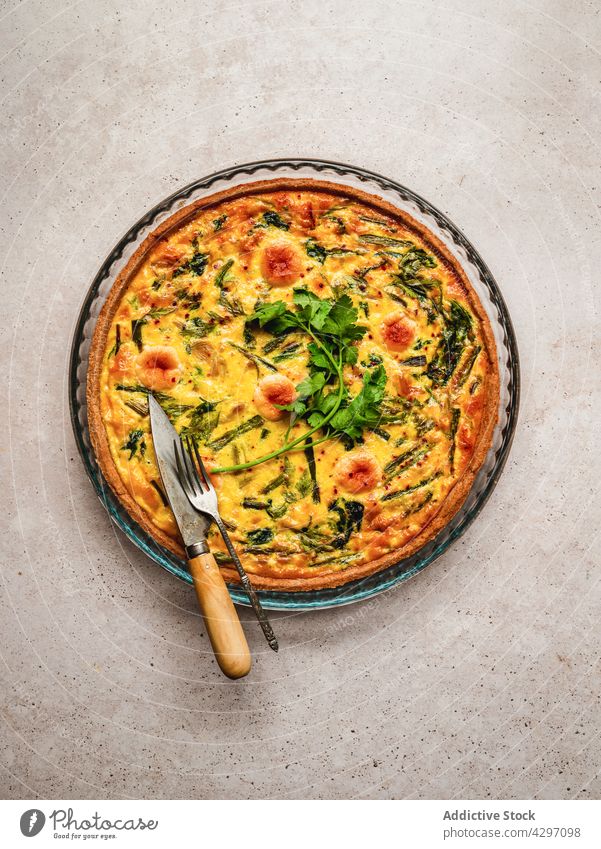 Delicious quiche placed near ingredients tart dish food fresh nutrition cuisine vegetable french tradition parsley authentic organic herb culinary gastronomy