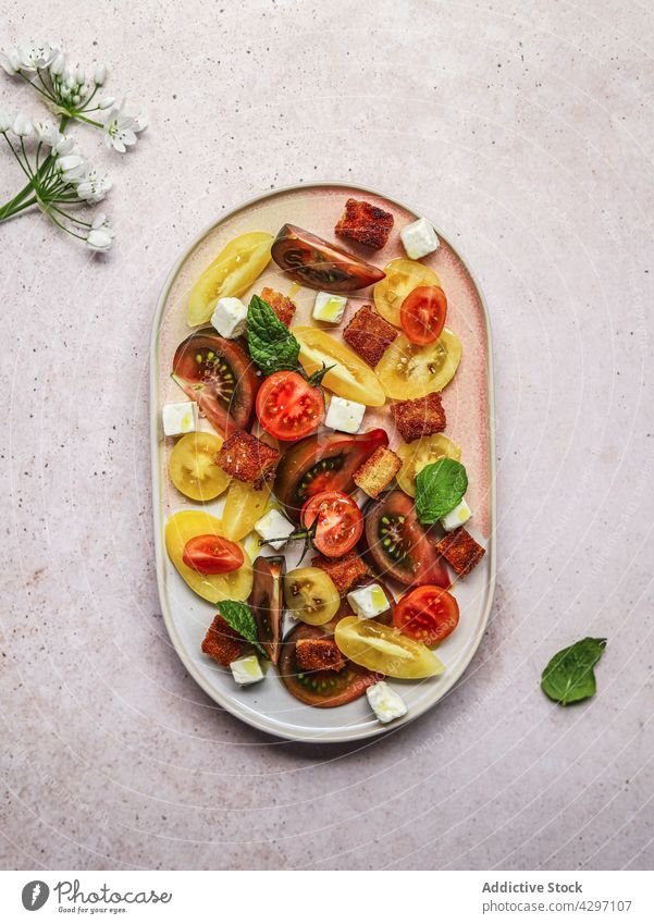 Healthy tomato salad with feta cheese plate ingredient serve lunch healthy food vegetable meal dish vegetarian nutrition fresh cuisine organic diet culinary