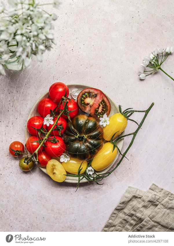 Healthy tomato salad on gray concrete table plate ingredient serve lunch healthy food vegetable meal dish vegetarian nutrition fresh cuisine organic diet