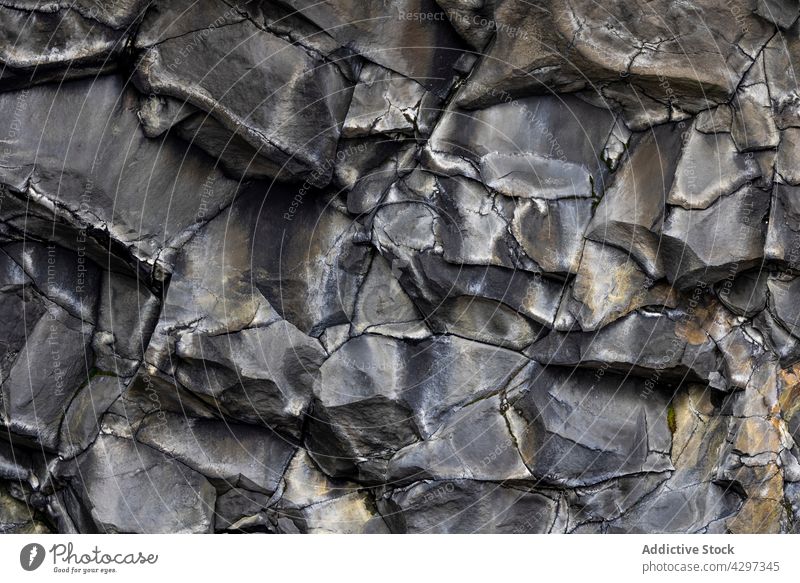 Rough surface of rock formation cliff stone rough geology mineral nature uneven background iceland mountain terrain highland erosion hard solid texture boulder