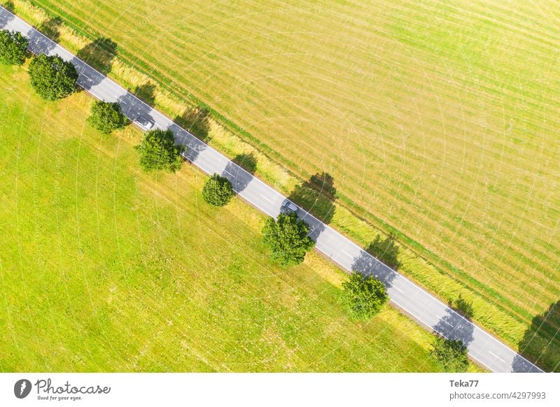 The highway Country road Street Road traffic Agriculture country Summer aerial photograph acre Meadow