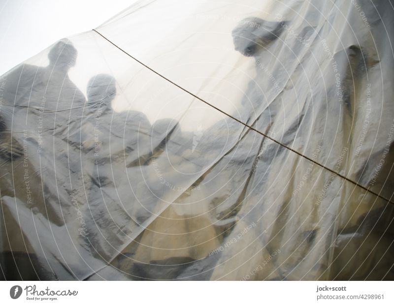 Group of figures wrapped in plastic sheeting Work of art Sculpture Tourist Attraction Budapest Monument Historic Transparent Encased in Subdued colour