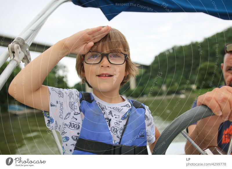 child wearing glasses looking happily to the horizon and saluting like a captain Human being Emotions Child Parents Senses Meditation Calm Brothers and sisters
