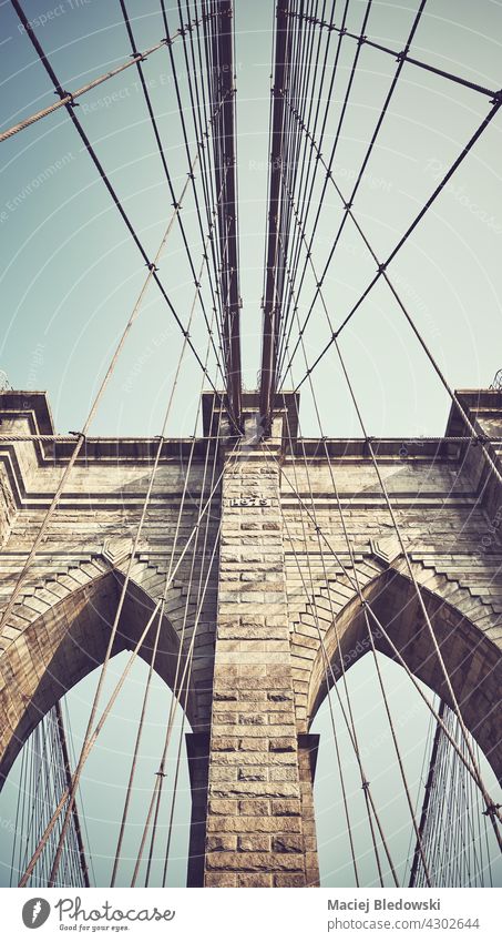 Close up picture of Brooklyn Bridge, color toning applied, New York City, USA city close up Big Apple retro vintage bridge filtered NYC urban travel landmark