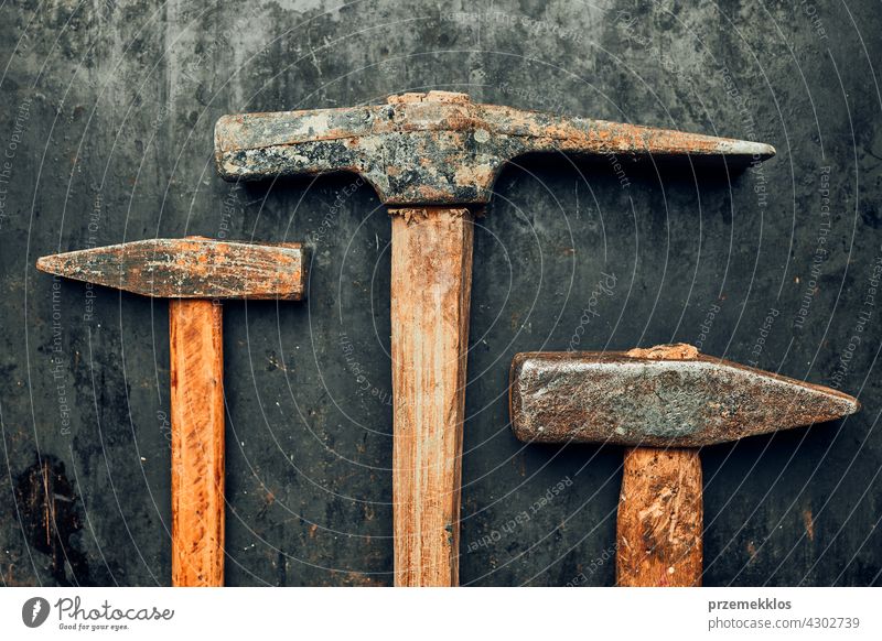 Old hammers on steel surface. Rusty tools for maintenance. Hardware tools to fix. Technical background with copy space metal hardware iron old used heavy useful