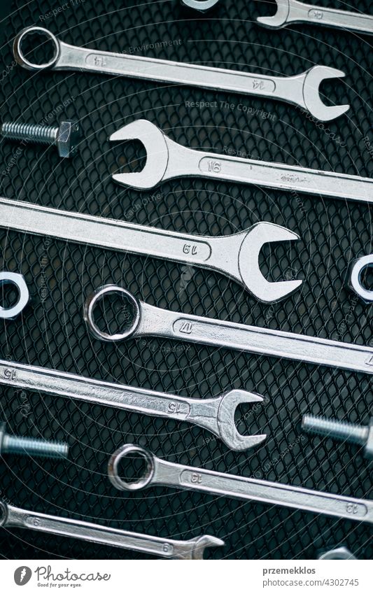 Set of chrome wrenches on steel surface. Mechanic tools for maintenance. Hardware tools to fix metal hardware iron used heavy useful workshop improvement supply