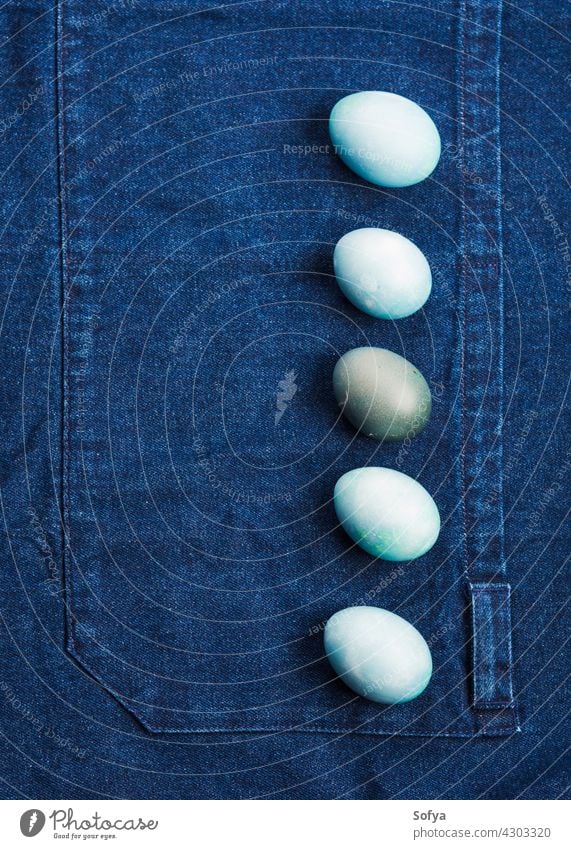 Easter boiled colorful eggs on jeans background easter blue holiday spring design food hen hard flat lay table copy space celebrate festive texture hunt minimal