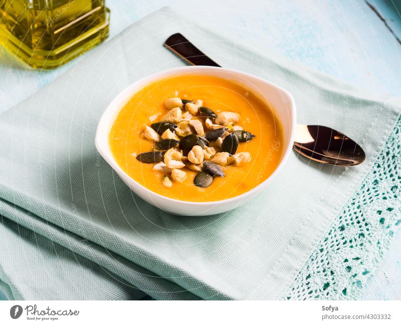 Bean squash creamy soup served with seeds and nuts pumpkin vegetable autumn bean bowl cannellini puree cashew chickpea cuisine delicious dinner carrot fall food