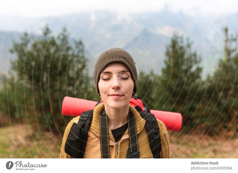 Dreamy traveling woman enjoying freedom in mountains traveler dreamy carefree backpacker nature female summer vacation happy highland cheerful eyes closed