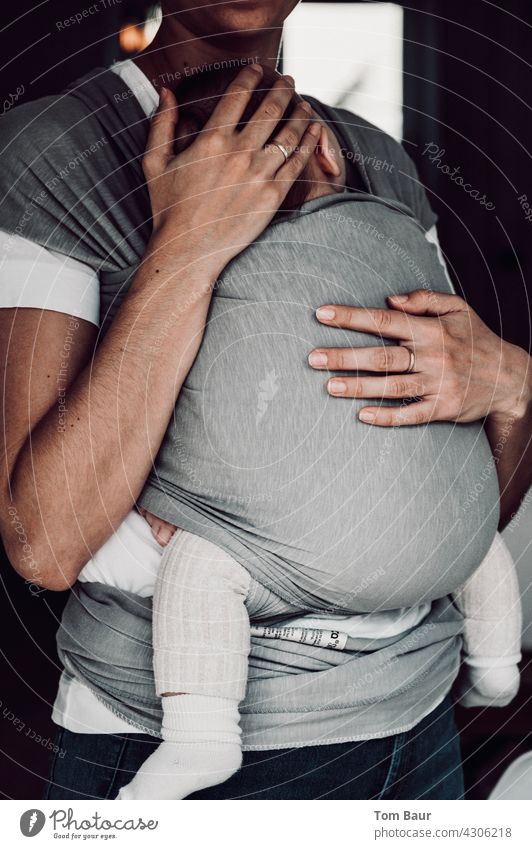 Mother happiness - baby is tied in sling around mother's upper body and sleeps Baby Motherly love baby sling Carrying Child Safety (feeling of) Happy Protection