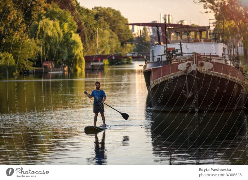 Man on a Paddle Board, Holland canal Netherland Active Adult Balance Boarding Body Calm Enjoyment Exercise Fit Fitness Fun Healthy Hobby Lake Leisure Lifestyle