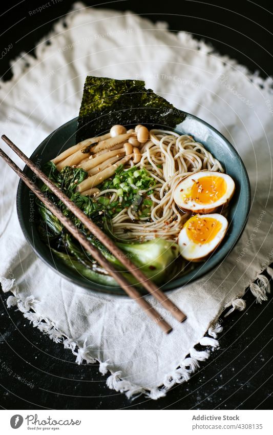 Bowl with yummy fresh ramen bowl dish tradition lunch chopstick tablecloth asian food cuisine delicious meal tasty gourmet japanese oriental dinner nutrition
