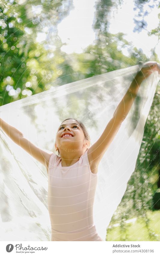 Delighted ballerina playing in summer park girl playful teenage ballet dancer happy meadow dress joy nature cheerful freedom carefree harmony charming enjoy