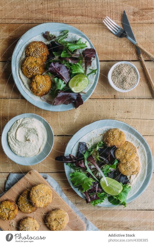 Plates with falafel and lettuce salad plate lime table kitchen tradition food sweet potato meal delicious tasty yummy dish fresh cuisine vegetable organic