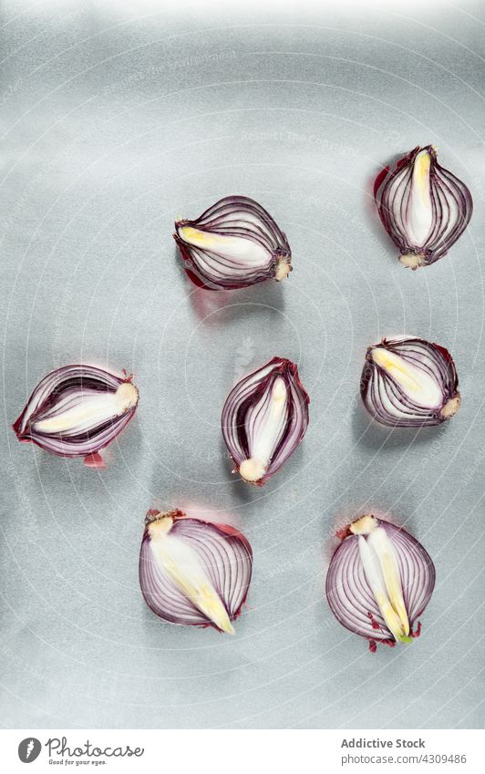 Red onion on gray surface vegetable halved natural food fresh minimal cut bulb color red purple violet organic healthy meal simple colorful ingredient