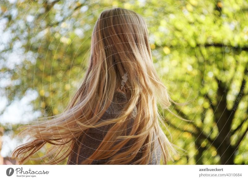 young woman shakes her long blonde hair Hair and hairstyles long hairs Blonde Shake Woman Feminine Long-haired Young woman Youth (Young adults) naturally Throw