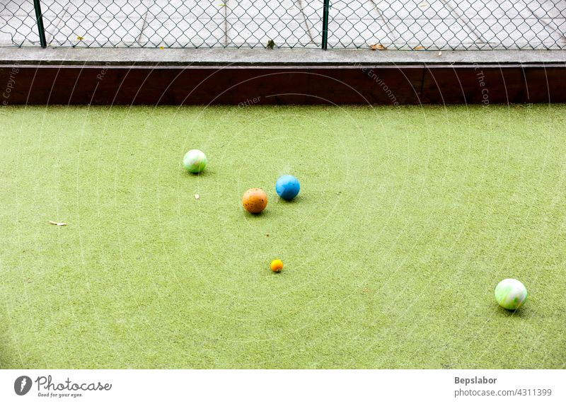 Photo of Italian Bowls game bocce bowling and play golf synthetic grass hand ball sports team sports individual sports players fun people old people shooting