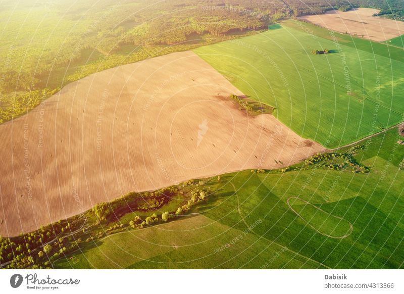 Aerial view of agricultural and green fields in countryside landscape panorama aerial agriculture outdoor nature over summer high fly atmosphere space above
