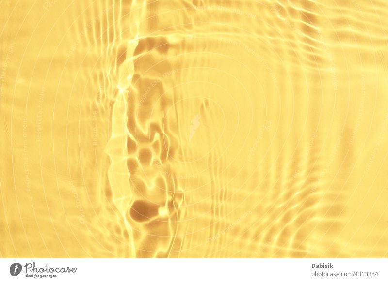 Yellow water texture background. Abstract pattern yellow surface aqua drop wave light clear ripple backdrop overlay effect nature pastel product summer abstract