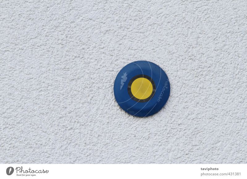 button on grunge wall Tool Technology Concrete Plastic Sign Key Dark Thin Authentic Kitsch Small Blue Yellow Gray Colour photo Exterior shot Deserted