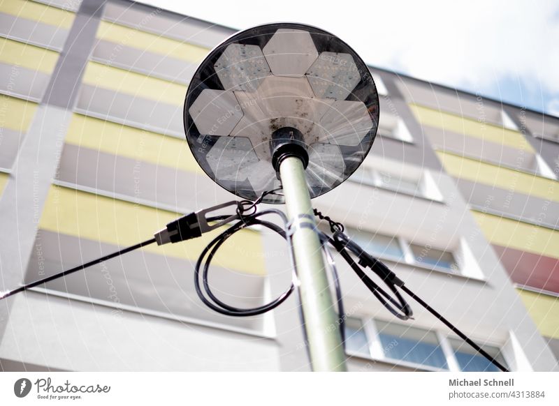 Lantern in front of a multi-storey residential building Apartment Building Life City life Town House (Residential Structure) Living or residing Facade