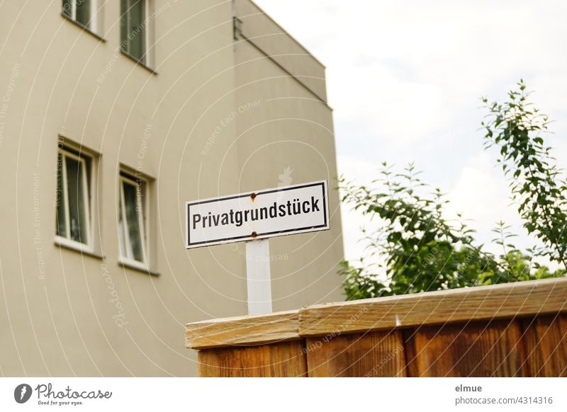 Private property is written on the sign at the entrance to a multi-storey house / property ownership private property House (Residential Structure)