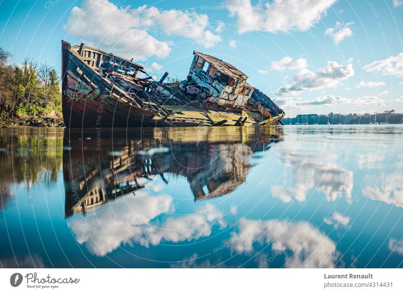 Wreck of a wooden fishing boat abandoned in the clouds Rance blue coast hull marine nature old quelmer river sea ship shipwreck sky vessel water