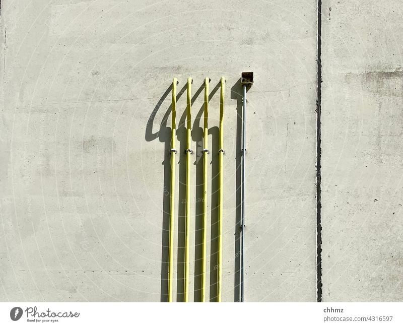 perpendicular Pipe Wall (building) Transmission lines Wall (barrier) Facade Concrete wall Detail Conduit Building Manmade structures Shadow Shadow play